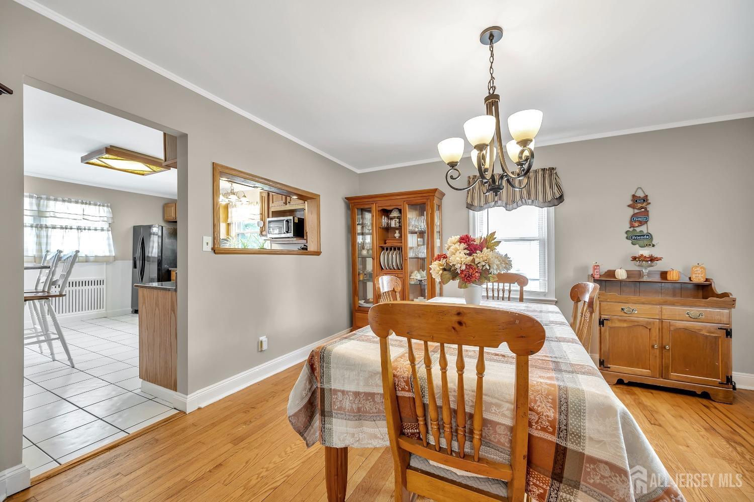446 2nd Street Dunellen, NJ 08812 - Photo 18 of 31 a very nice looking dining room with wooden floor and chandelier
