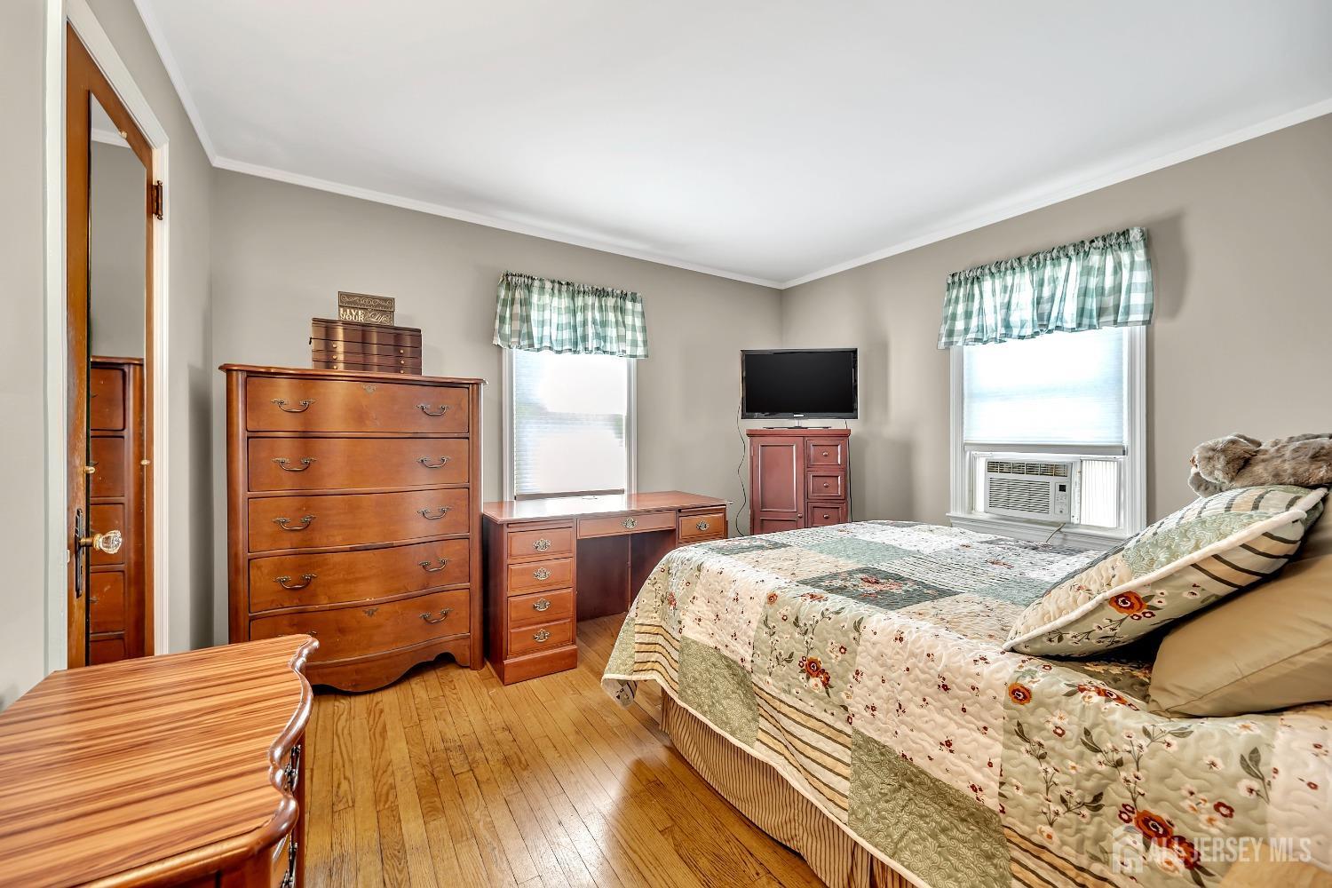 446 2nd Street Dunellen, NJ 08812 - Photo 19 of 31 a bedroom with a bed and a flat screen tv