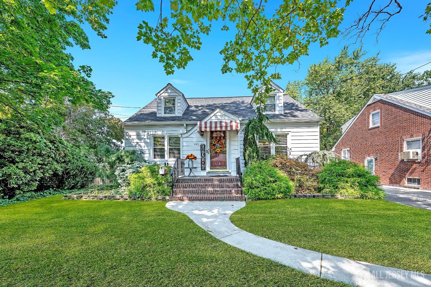 446 2nd Street Dunellen, NJ 08812 - Photo 2 of 31 a front view of a house with a garden