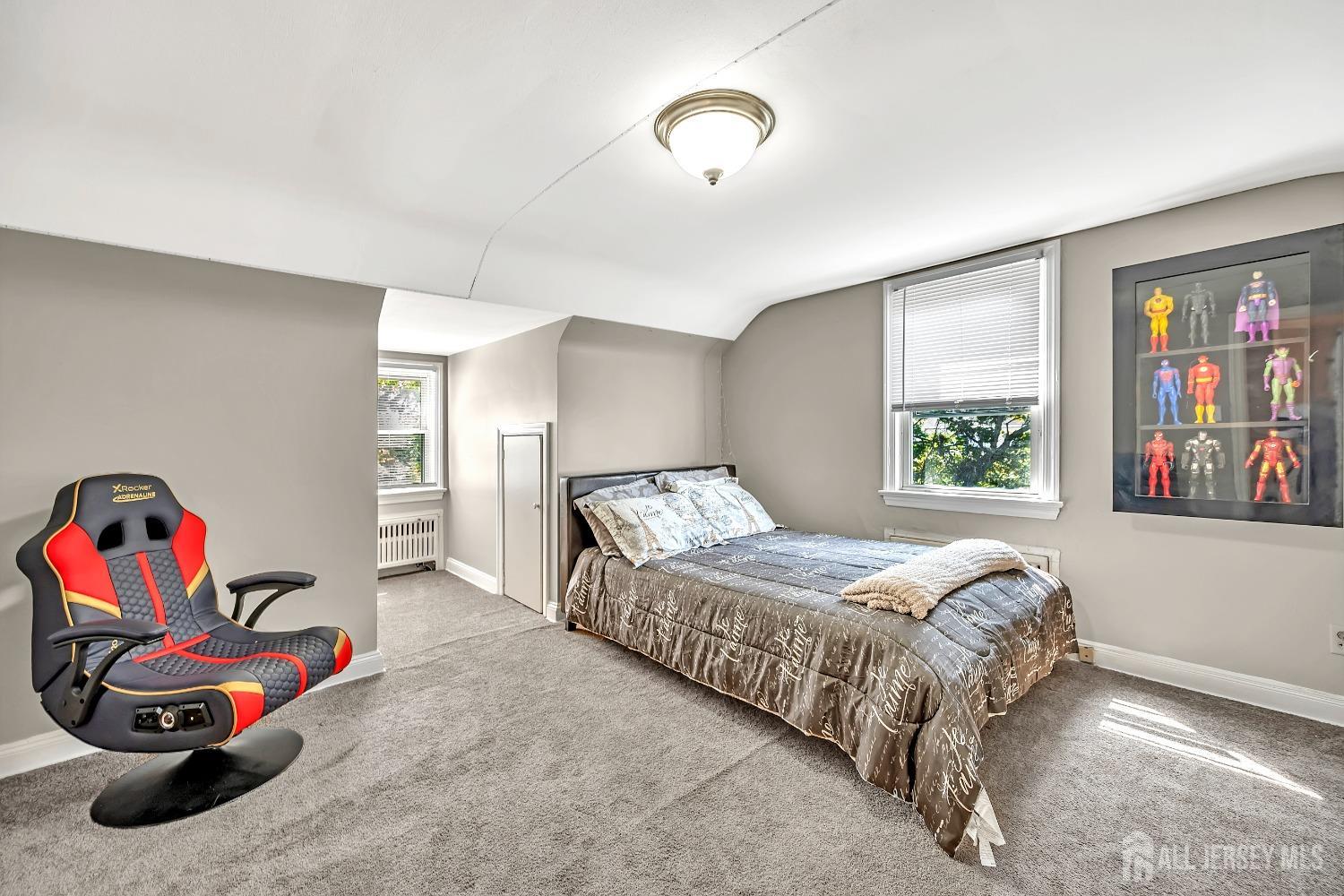 446 2nd Street Dunellen, NJ 08812 - Photo 21 of 31 a bedroom with a bed and a painting on the wall