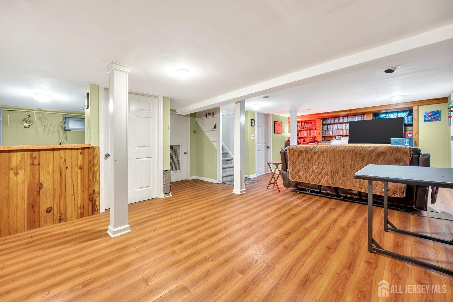 446 2nd Street Dunellen, NJ 08812 - Photo 24 of 31 a living room with furniture and a wooden floor