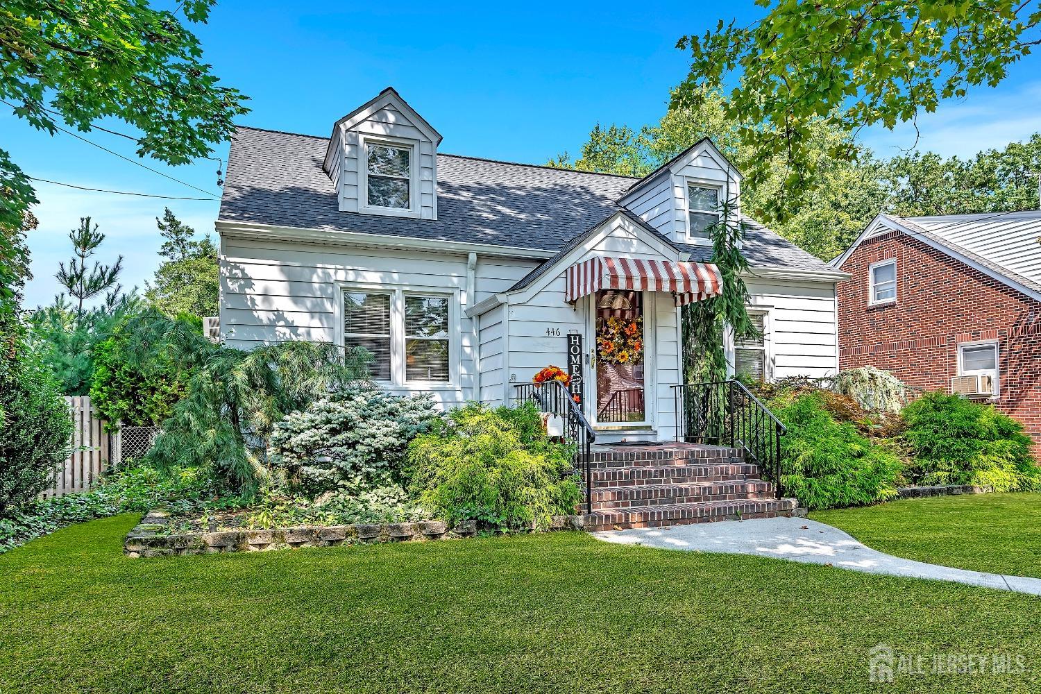 446 2nd Street Dunellen, NJ 08812 - Photo 4 of 31 a front view of a house with a garden