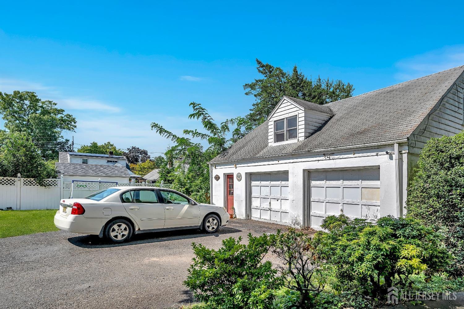446 2nd Street Dunellen, NJ 08812 - Photo 7 of 31 a view of a car parked in front of a house