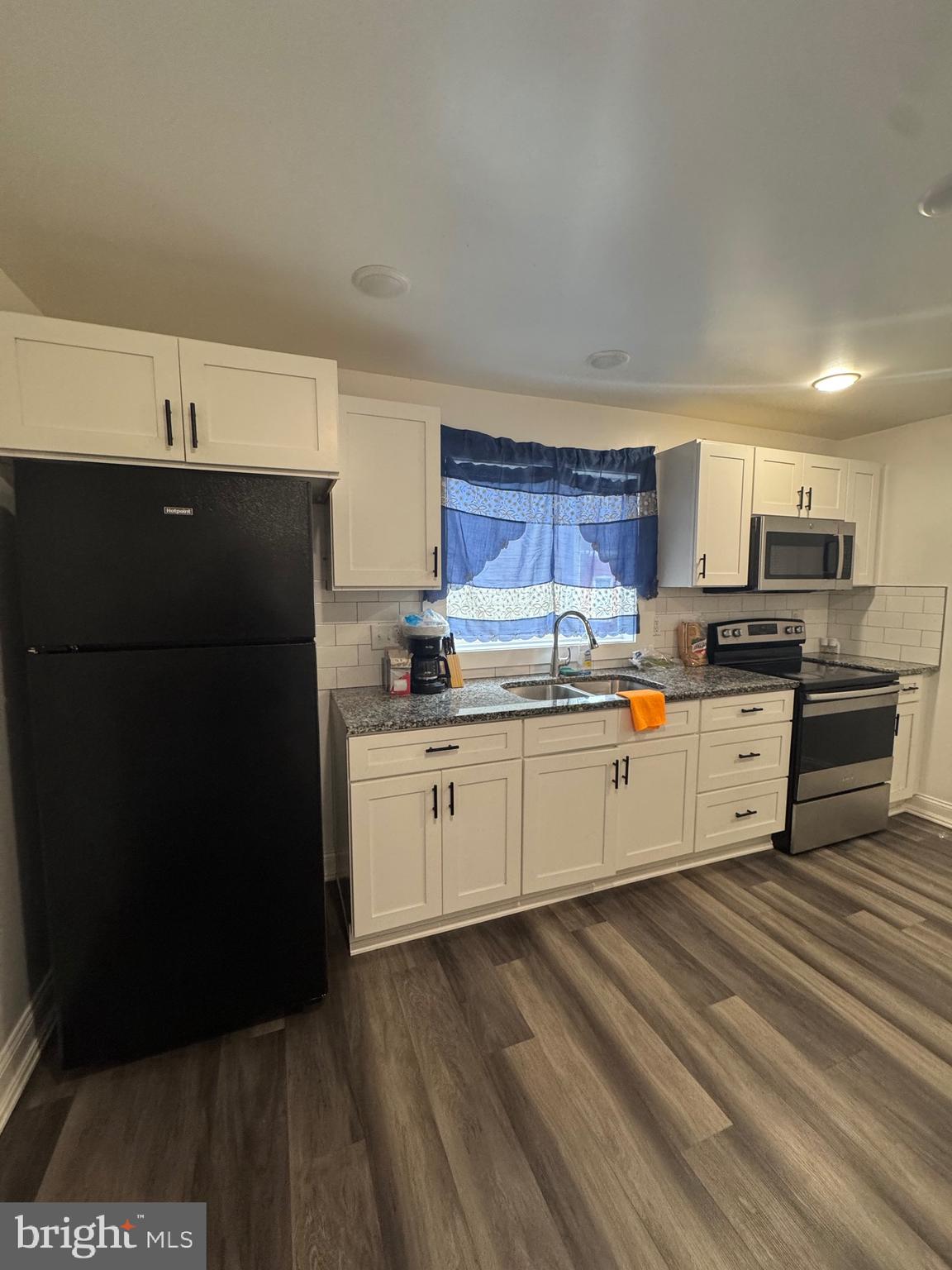 519 3rd Street Lancaster, PA 17603 - Photo 4 of 13 a kitchen with stainless steel appliances granite countertop a refrigerator sink and cabinets