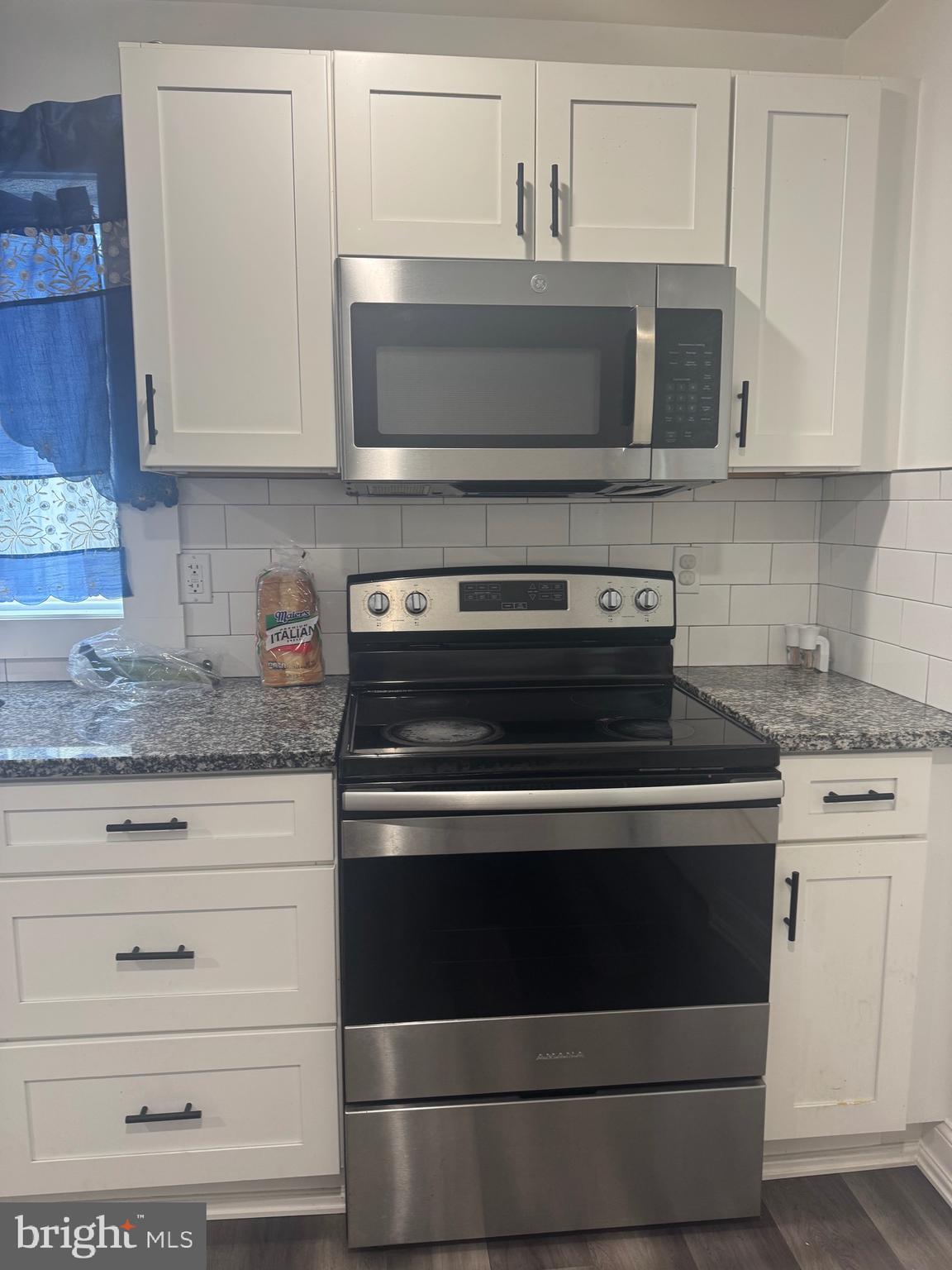 519 3rd Street Lancaster, PA 17603 - Photo 5 of 13 a stove top oven sitting inside of a kitchen