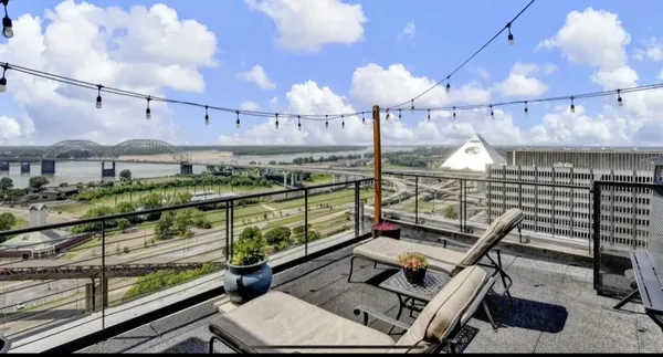 a view of a balcony with chairs