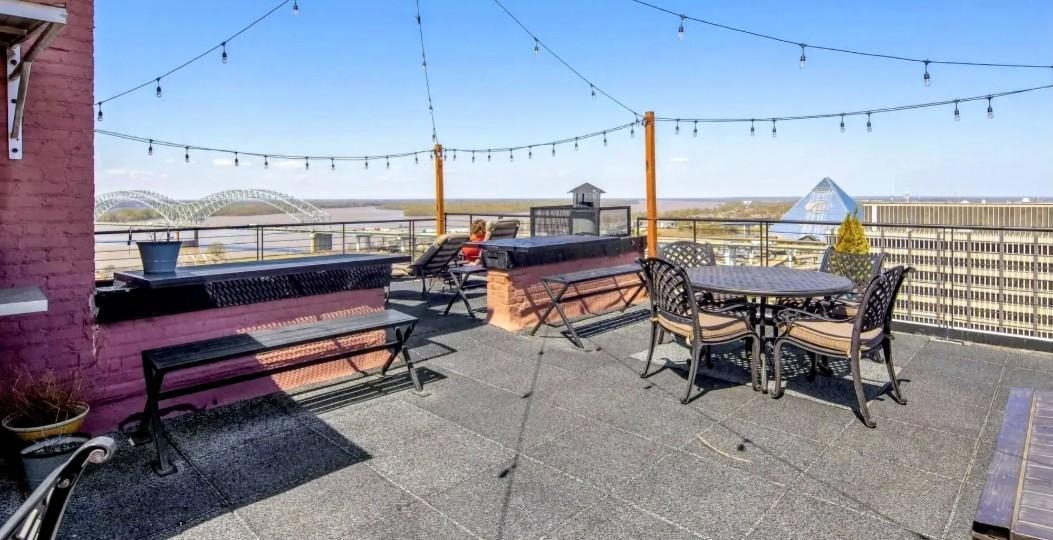109 North Main Street, Unit 1007 Memphis, TN 38103 - Photo 16 of 18 a view of a patio with a table and chairs