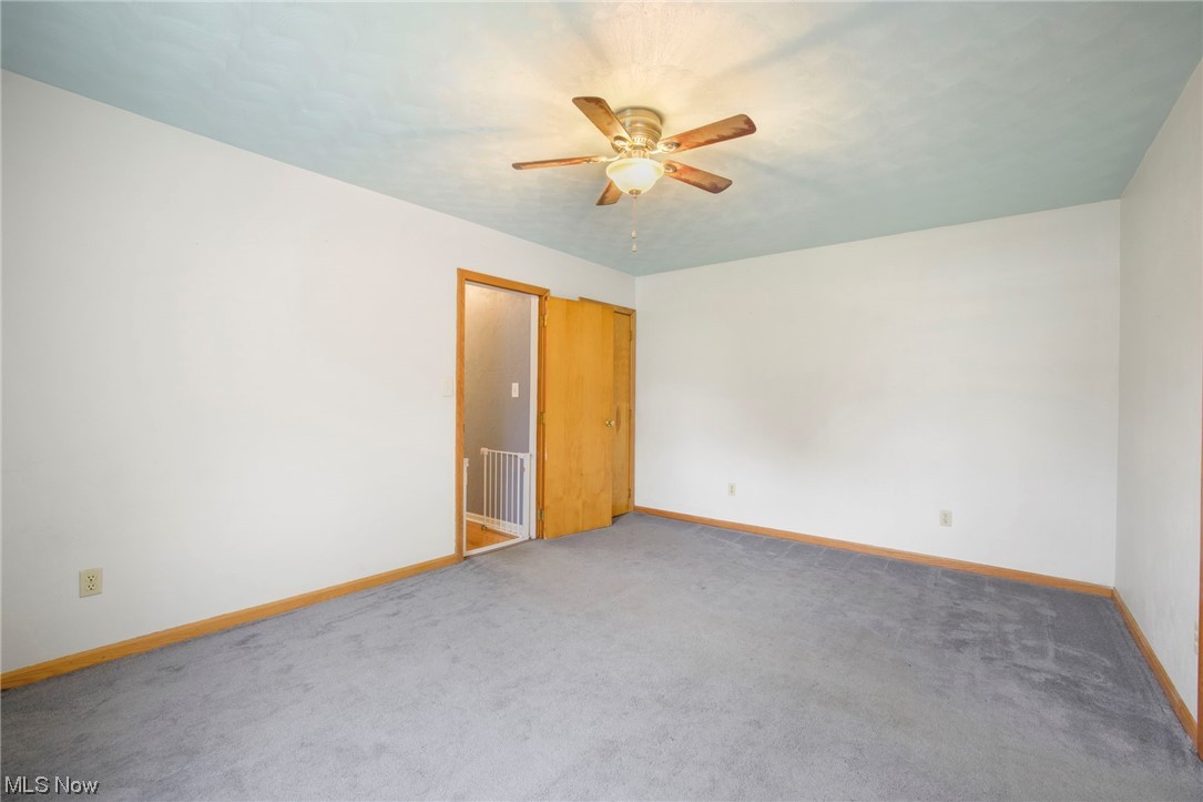6322 Homeworth Road Homeworth, OH 44634 - Photo 12 of 36 room with ceiling fan and carpet flooring