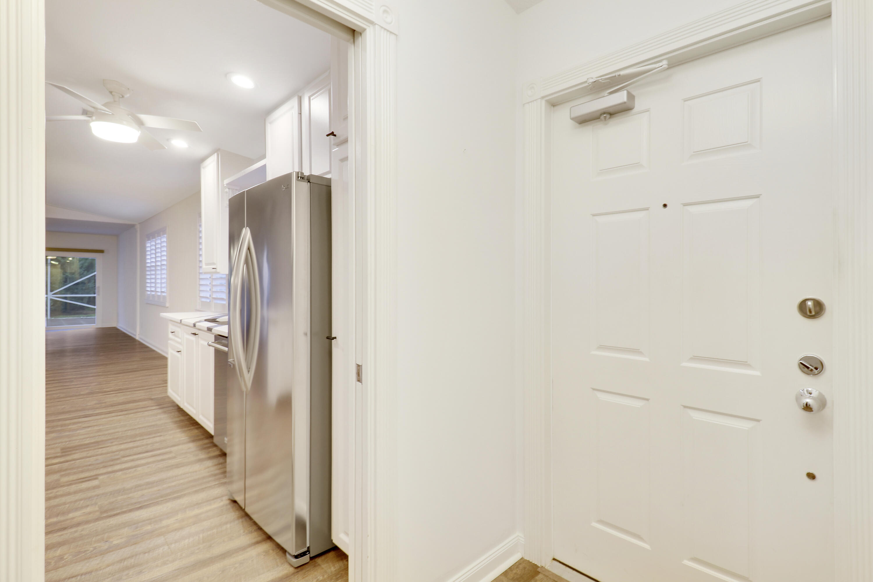918 Southwest Balmoral Trace Stuart, FL 34997 - Photo 12 of 20 a view of a hallway with wooden floor