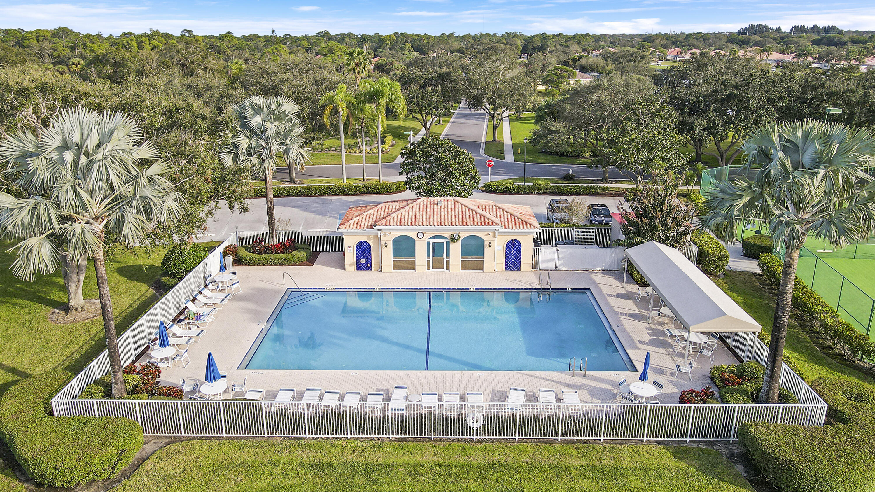 918 Southwest Balmoral Trace Stuart, FL 34997 - Photo 17 of 20 a view of a swimming pool with a yard