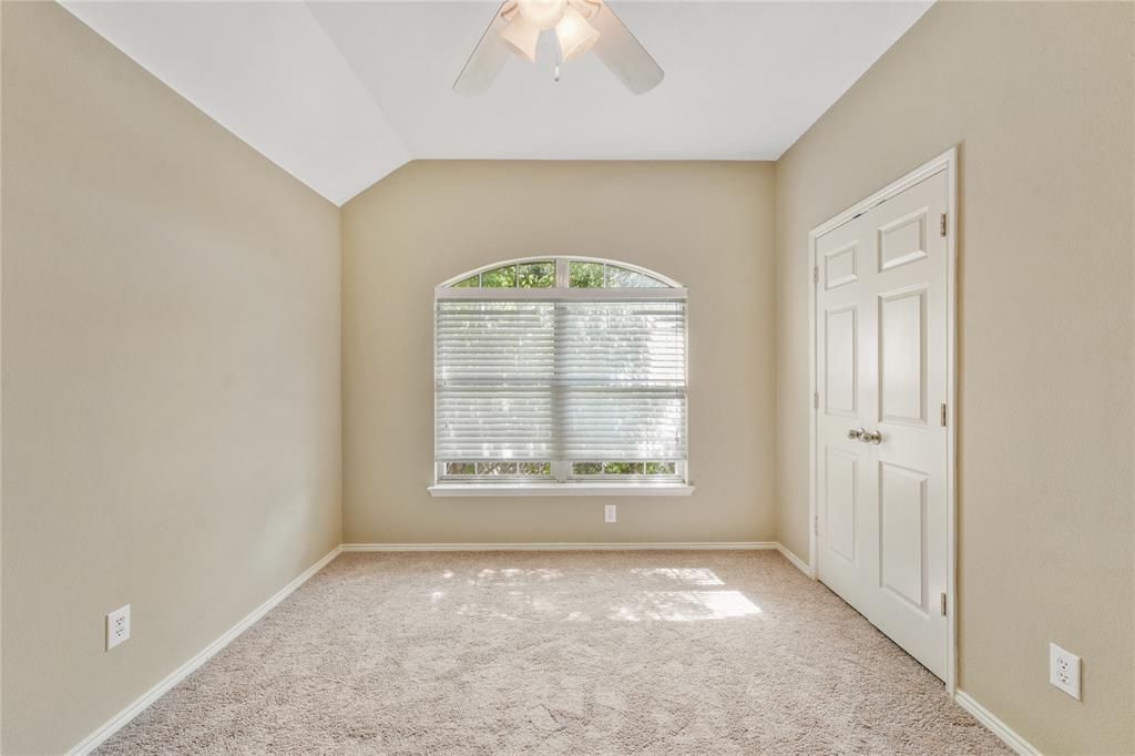 2003 Diamondback Forney, TX 75126 - Photo 24 of 30 Unfurnished bedroom with vaulted ceiling, ceiling fan, and carpet