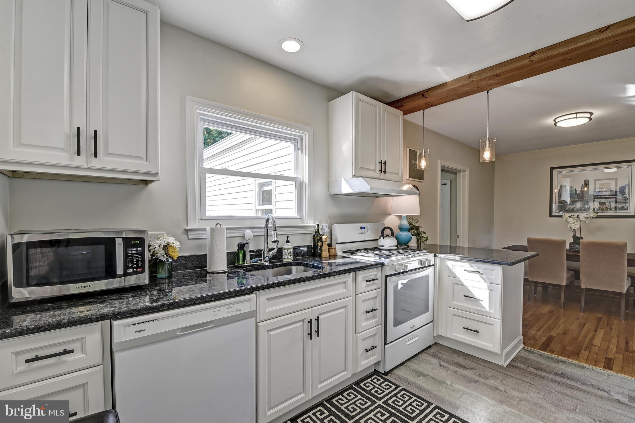 418 Range Road Baltimore, MD 21204 - Photo 11 of 39 Kitchen has white cabinetry and granite counters