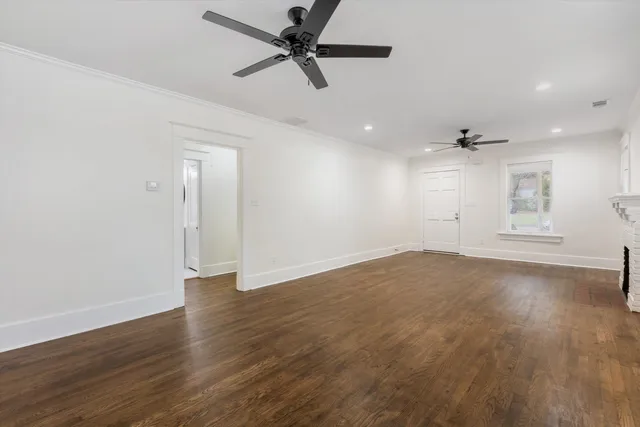 a kitchen with refrigerator and windows