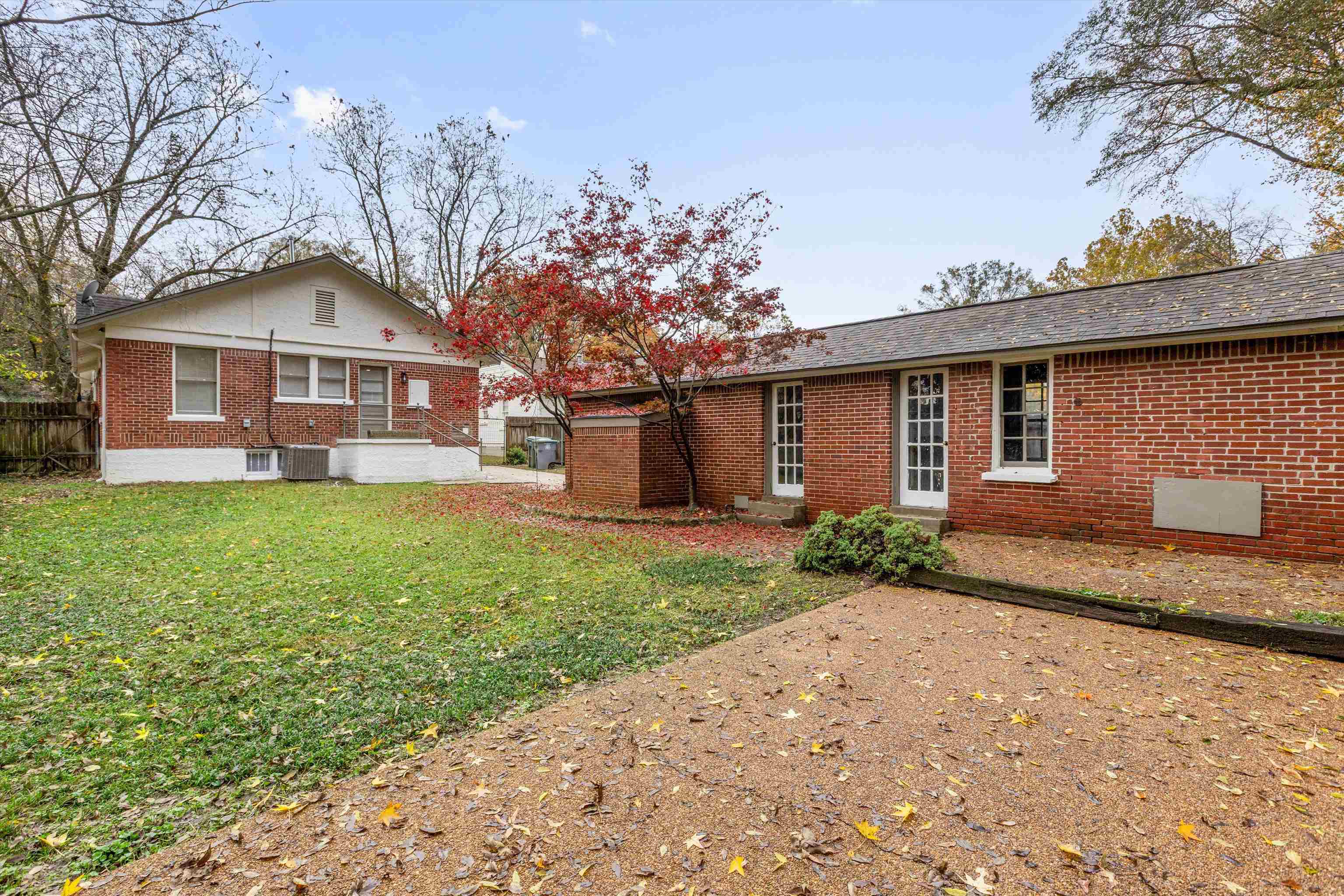 176 Plainview Street Memphis, TN 38111 - Photo 12 of 40 a front view of a house with a garden and yard