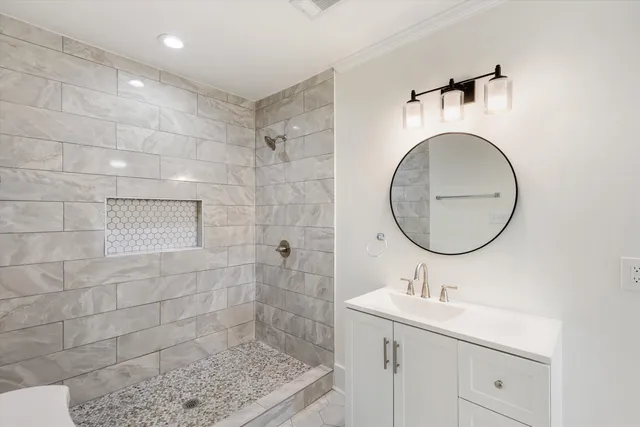 a bathroom with a sink toilet and shower