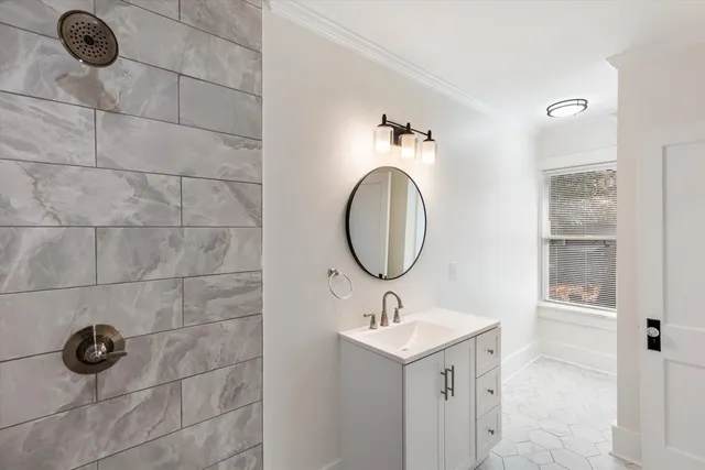 a bedroom with a bed and a flat tv screen