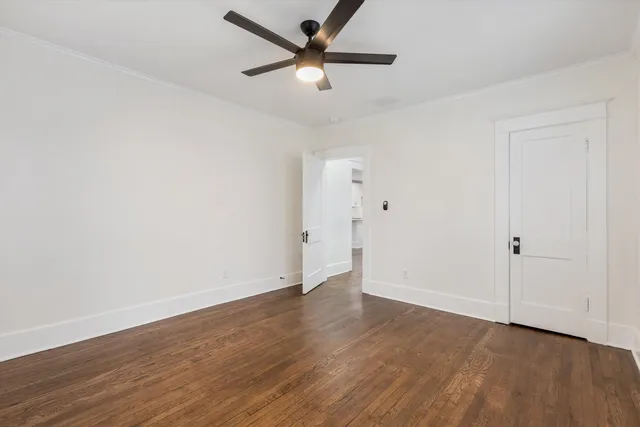 a bedroom with a bed window and couch
