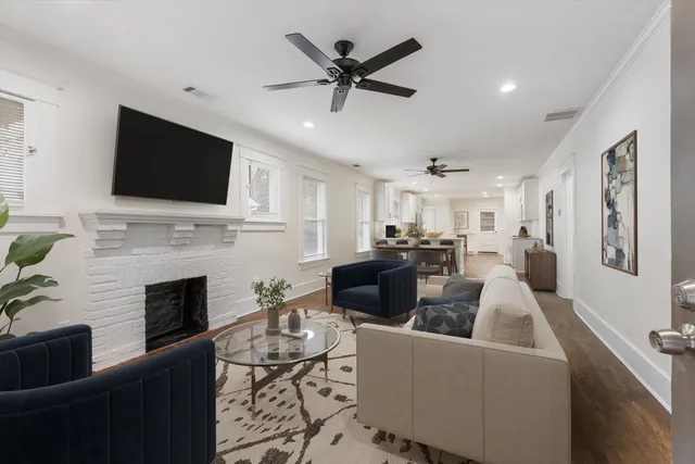 a view of a kitchen with wooden floor and a kitchen