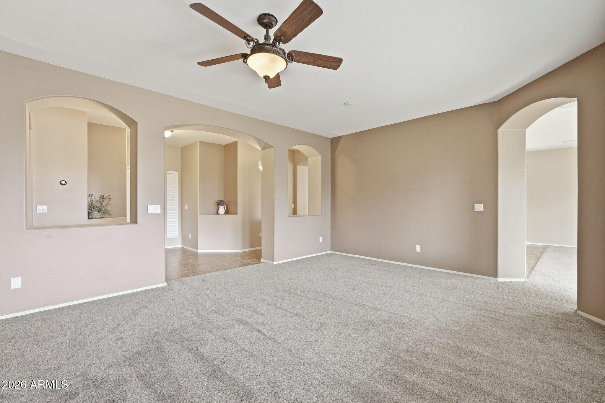 9917 Barley Road Florence, AZ 85132 - Photo 16 of 53 a view of an empty room with a ceiling fan
