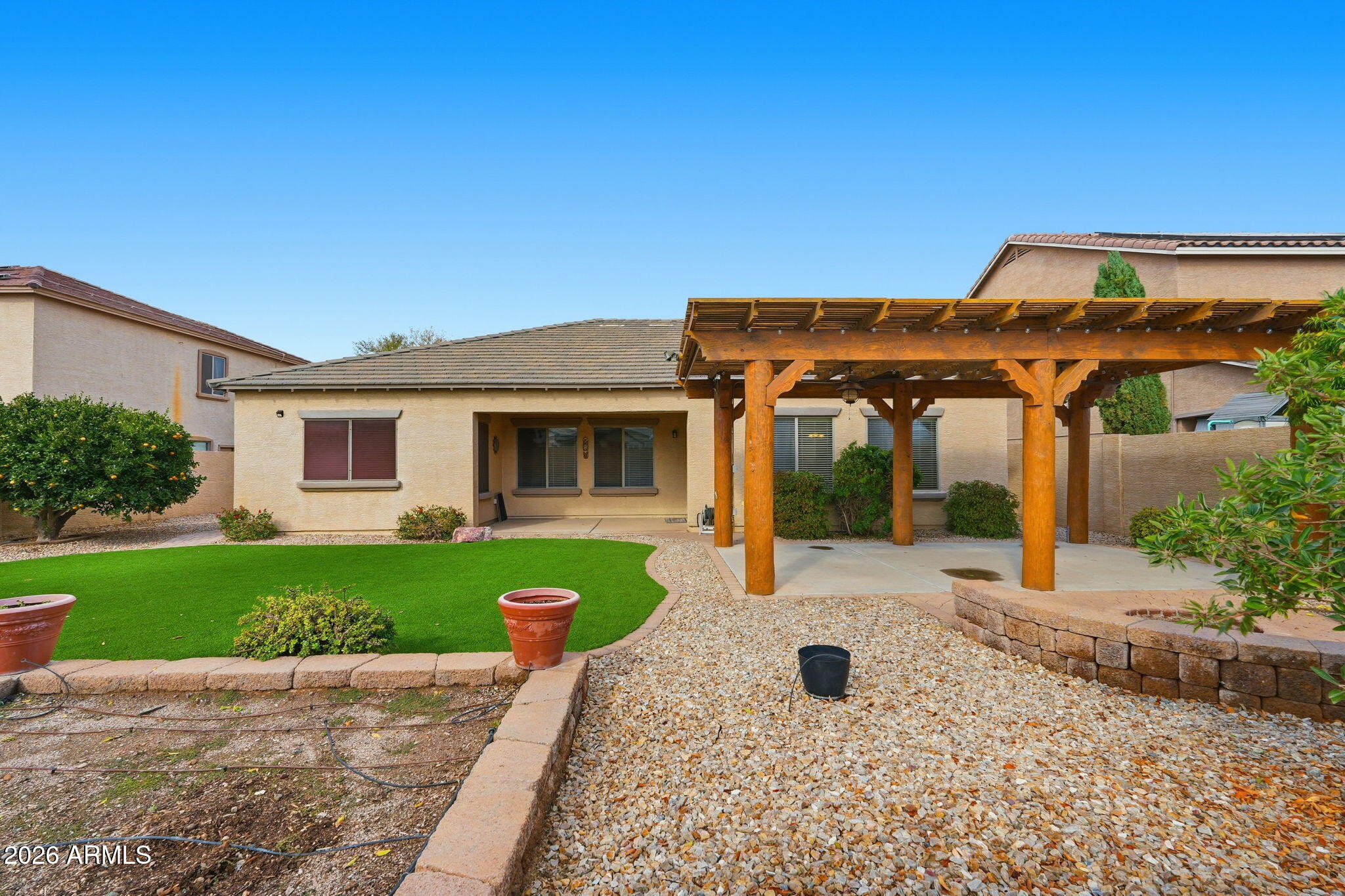 9917 Barley Road Florence, AZ 85132 - Photo 27 of 53 a front view of a house with a yard