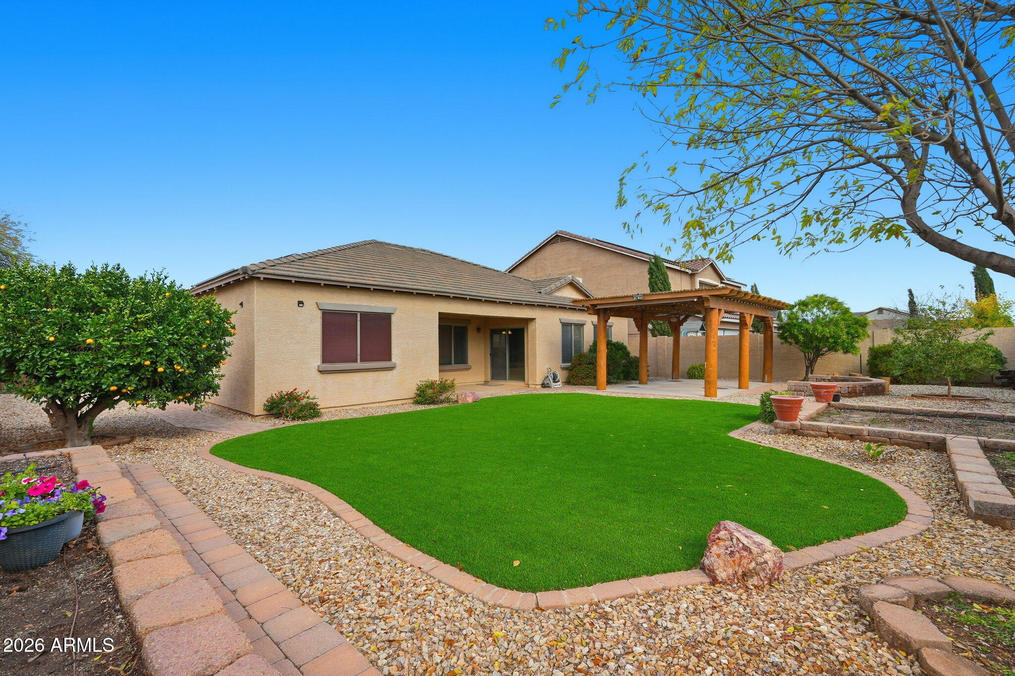 9917 Barley Road Florence, AZ 85132 - Photo 28 of 53 a front view of a house with garden