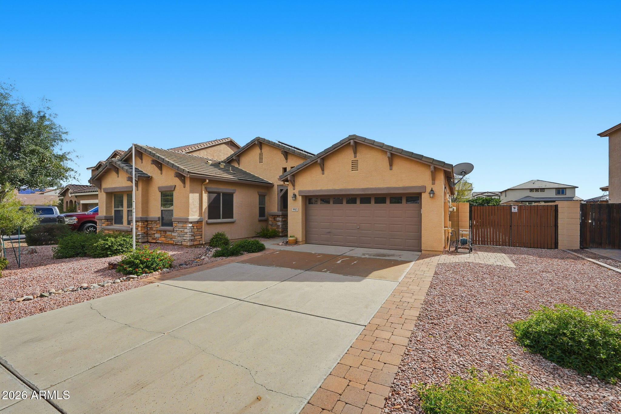 9917 Barley Road Florence, AZ 85132 - Photo 2 of 53 a front view of a house with a yard and garage