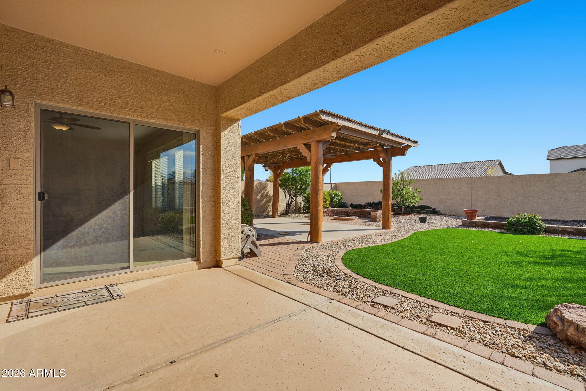 9917 Barley Road Florence, AZ 85132 - Photo 30 of 53 a view of a porch with a table and chairs under an umbrella