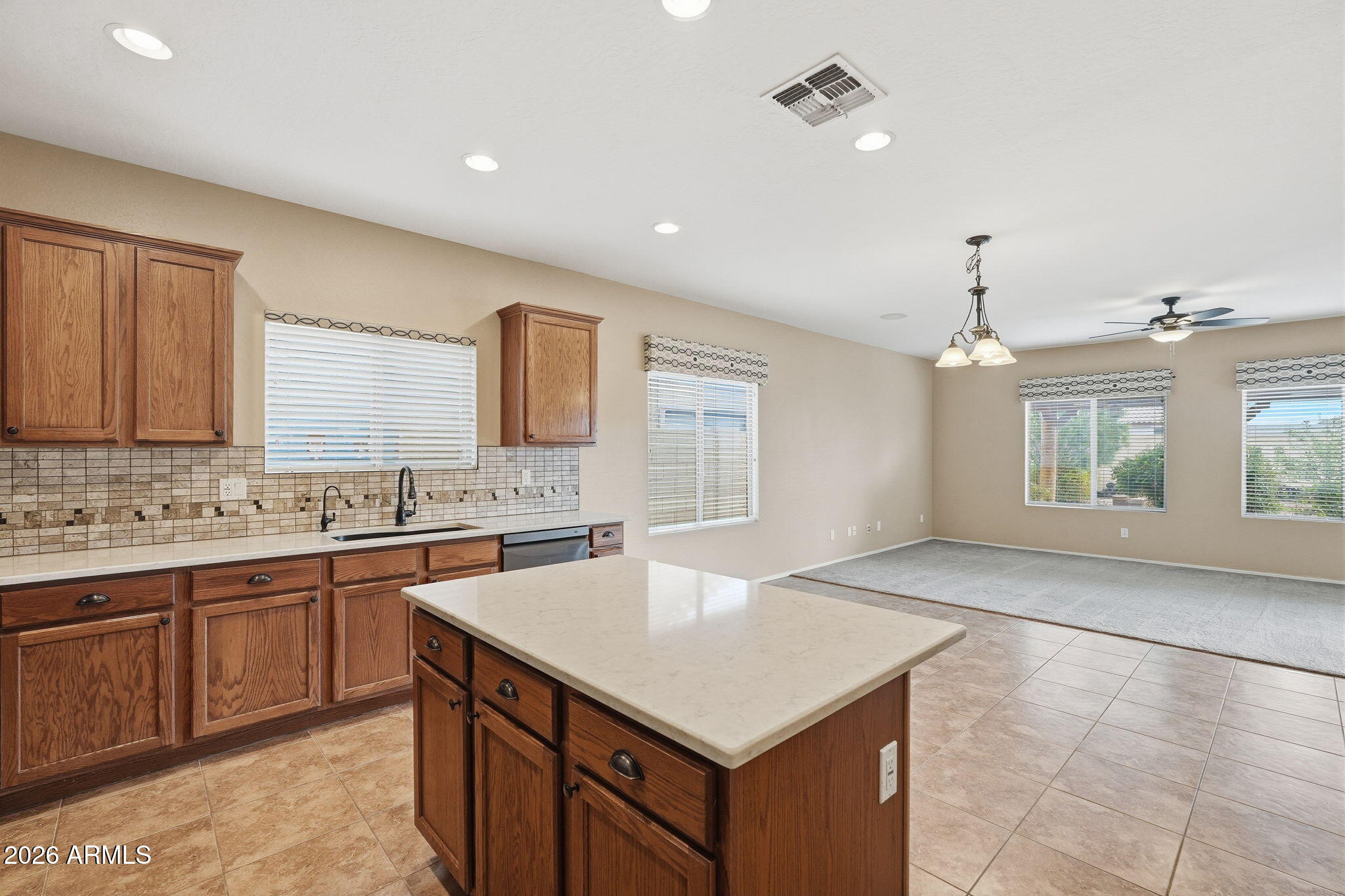 9917 Barley Road Florence, AZ 85132 - Photo 35 of 53 a kitchen with a sink a stove and cabinets