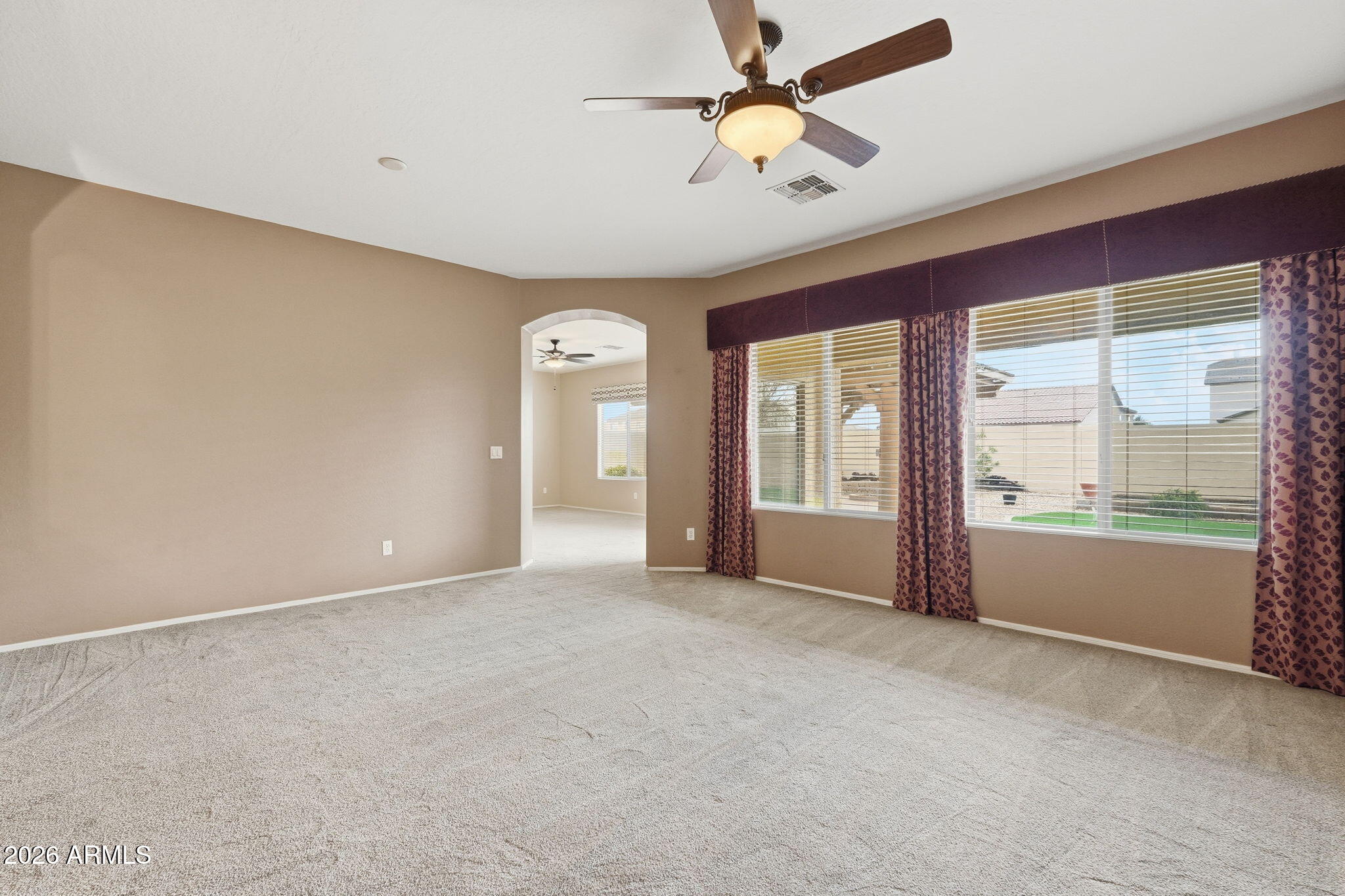 9917 Barley Road Florence, AZ 85132 - Photo 37 of 53 an empty room with windows and fan