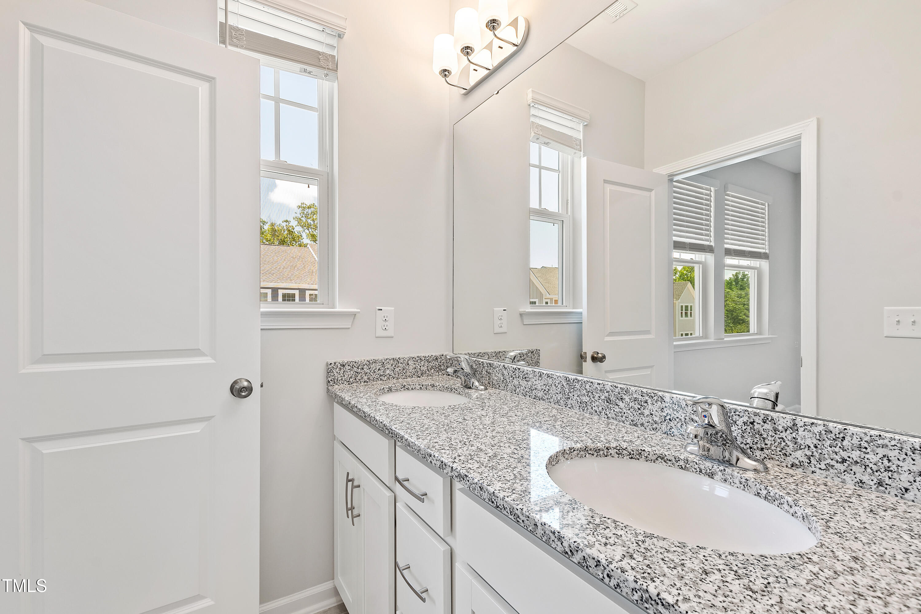 1102 Harmony Trail Durham, NC 27703 - Photo 17 of 33 a bathroom with a granite countertop sink and a mirror