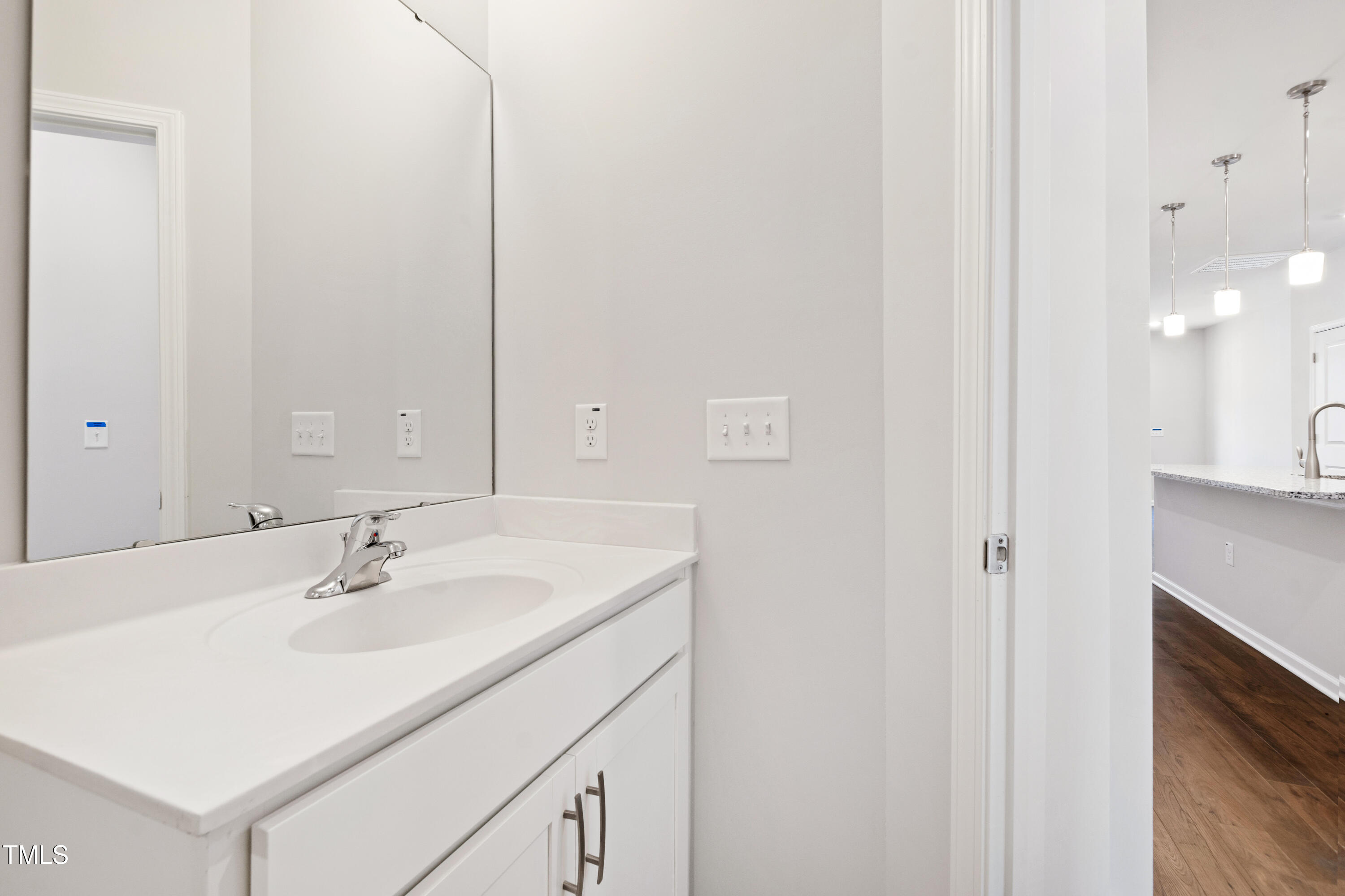 1102 Harmony Trail Durham, NC 27703 - Photo 19 of 33 a bathroom with a sink and a mirror