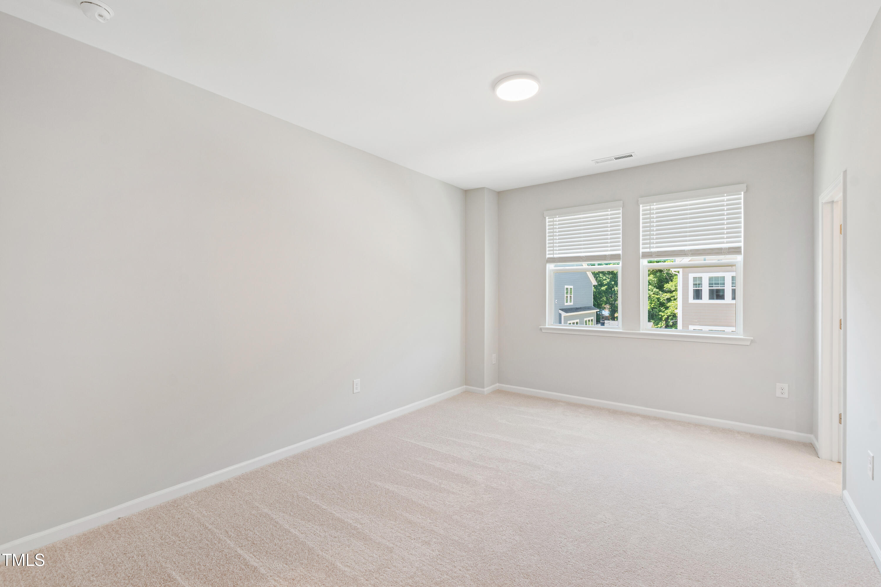 1102 Harmony Trail Durham, NC 27703 - Photo 23 of 33 an empty room with windows