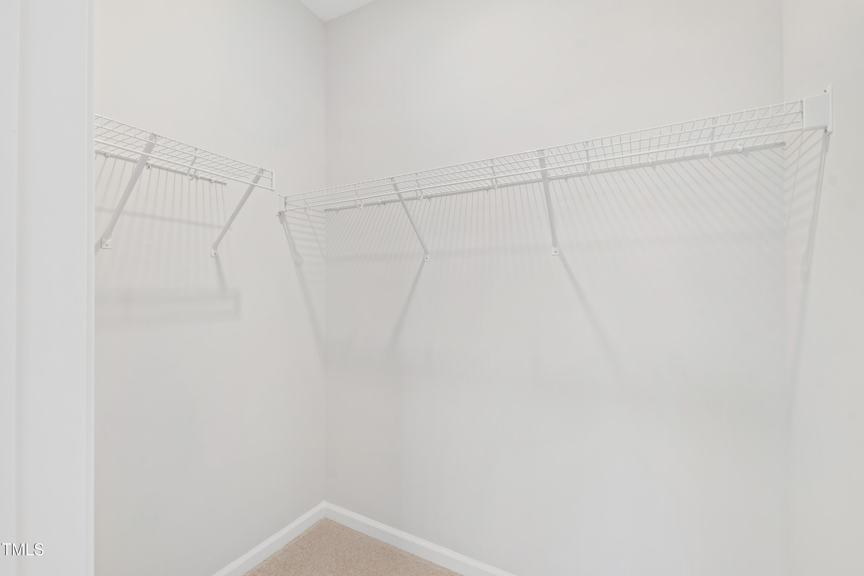 1102 Harmony Trail Durham, NC 27703 - Photo 26 of 33 a view of a room with racks on the wall