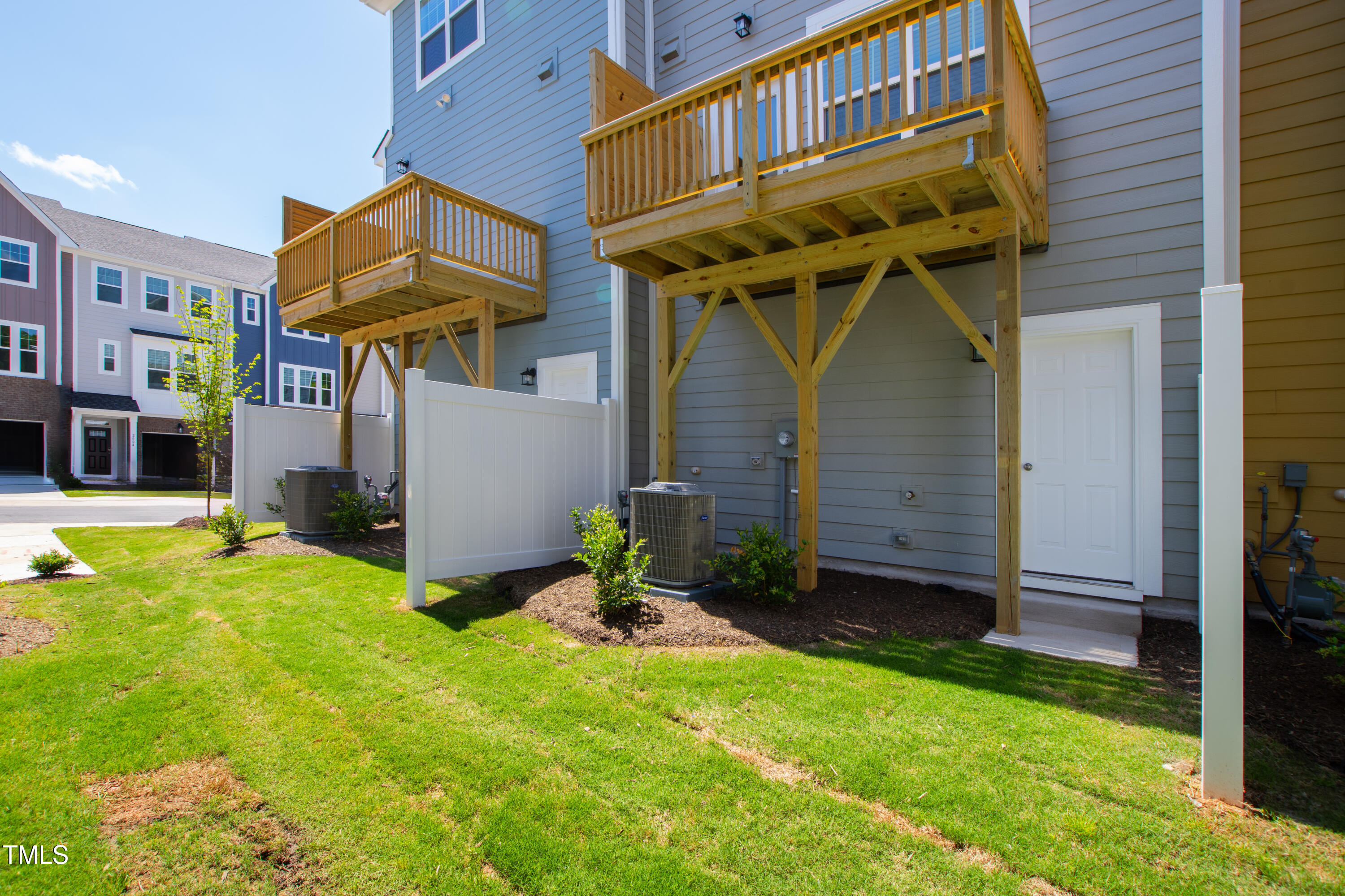 1102 Harmony Trail Durham, NC 27703 - Photo 32 of 33 a view of a house with a yard