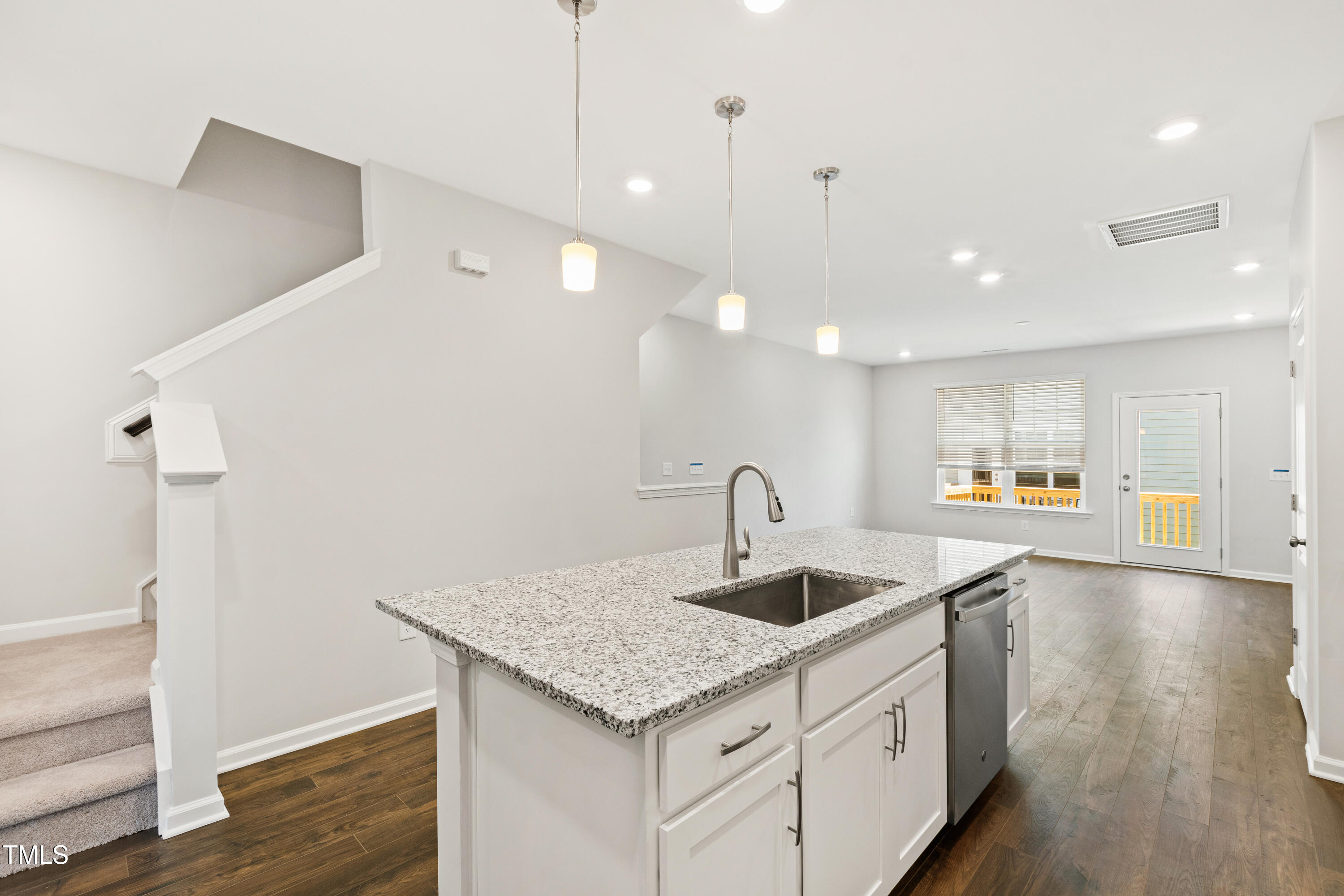 1102 Harmony Trail Durham, NC 27703 - Photo 4 of 33 a kitchen with a sink a refrigerator and wooden floor