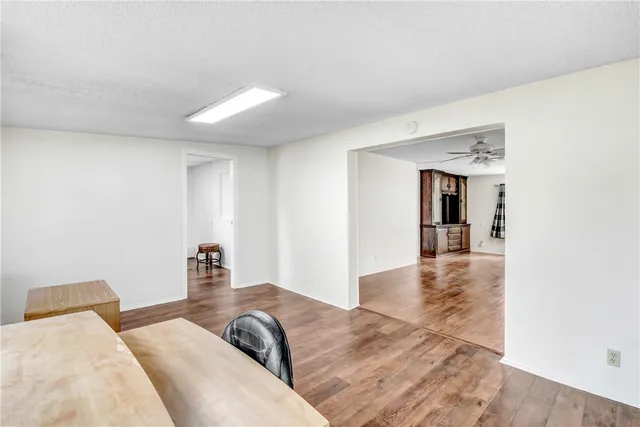 a view of a livingroom with furniture ceiling fan and window