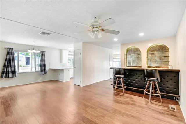 a view of a kitchen with a sink cabinet and a living room