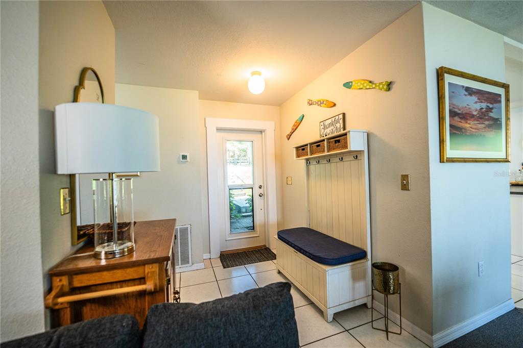 1702 North Scenic Highway Babson Park, FL 33827 - Photo 22 of 46 a living room with a couch and a table in it