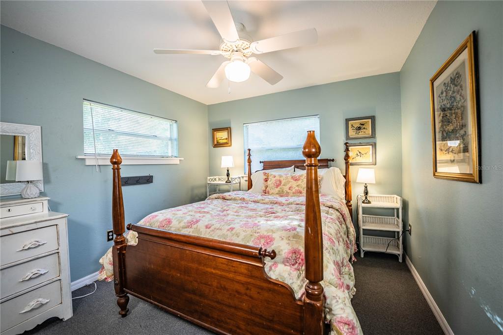 1702 North Scenic Highway Babson Park, FL 33827 - Photo 29 of 46 a bedroom with a bed and a chandelier