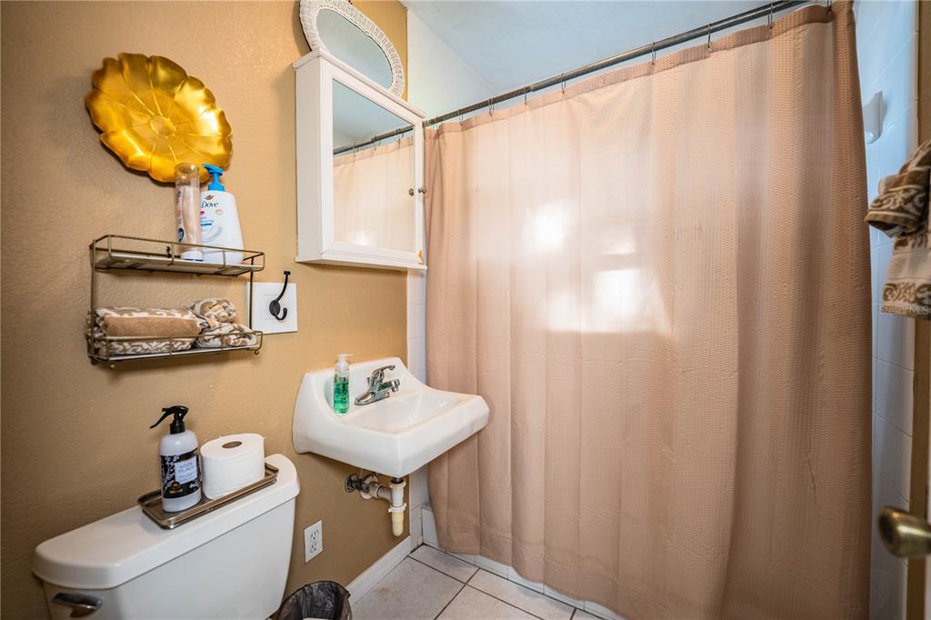 1702 North Scenic Highway Babson Park, FL 33827 - Photo 30 of 46 a bathroom with a sink and a mirror