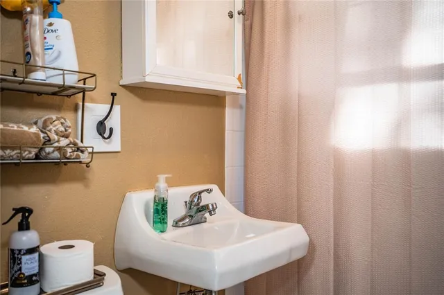 a bathroom with a sink and toilet