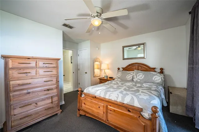 a bedroom with a bed and a dresser