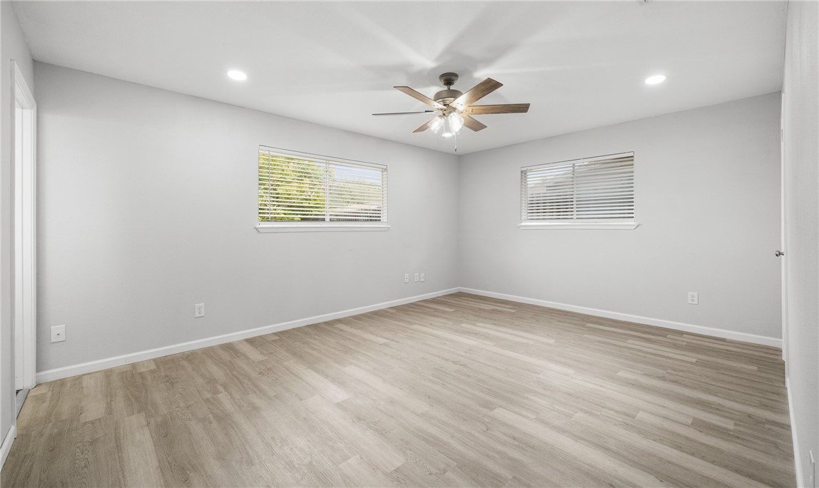 1021 Espana Drive Portland, TX 78374 - Photo 5 of 10 an empty room with a window and a fan