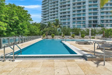 a view of a swimming pool with a lounge chair