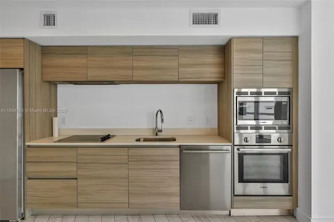 a kitchen with appliances and cabinets