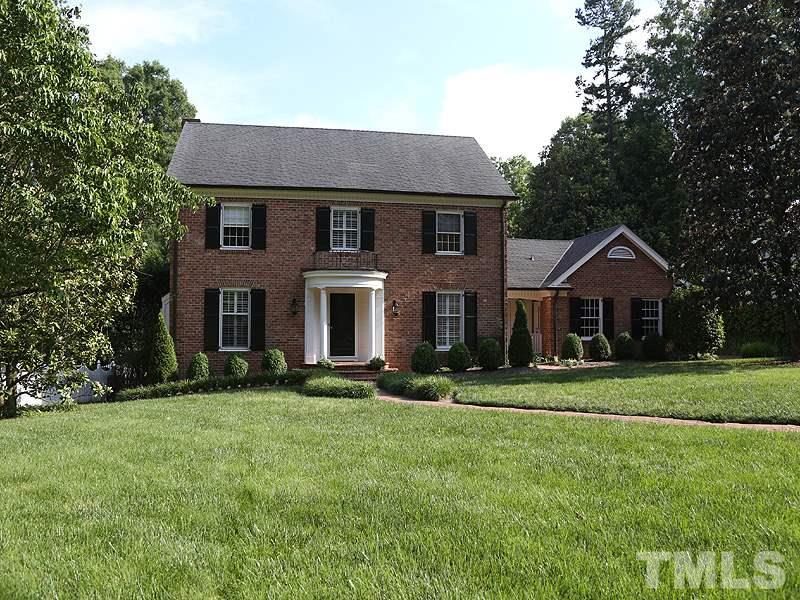 513 Spring Valley Drive Raleigh, NC 27609 - Photo 3 of 25 a front view of a house with a yard