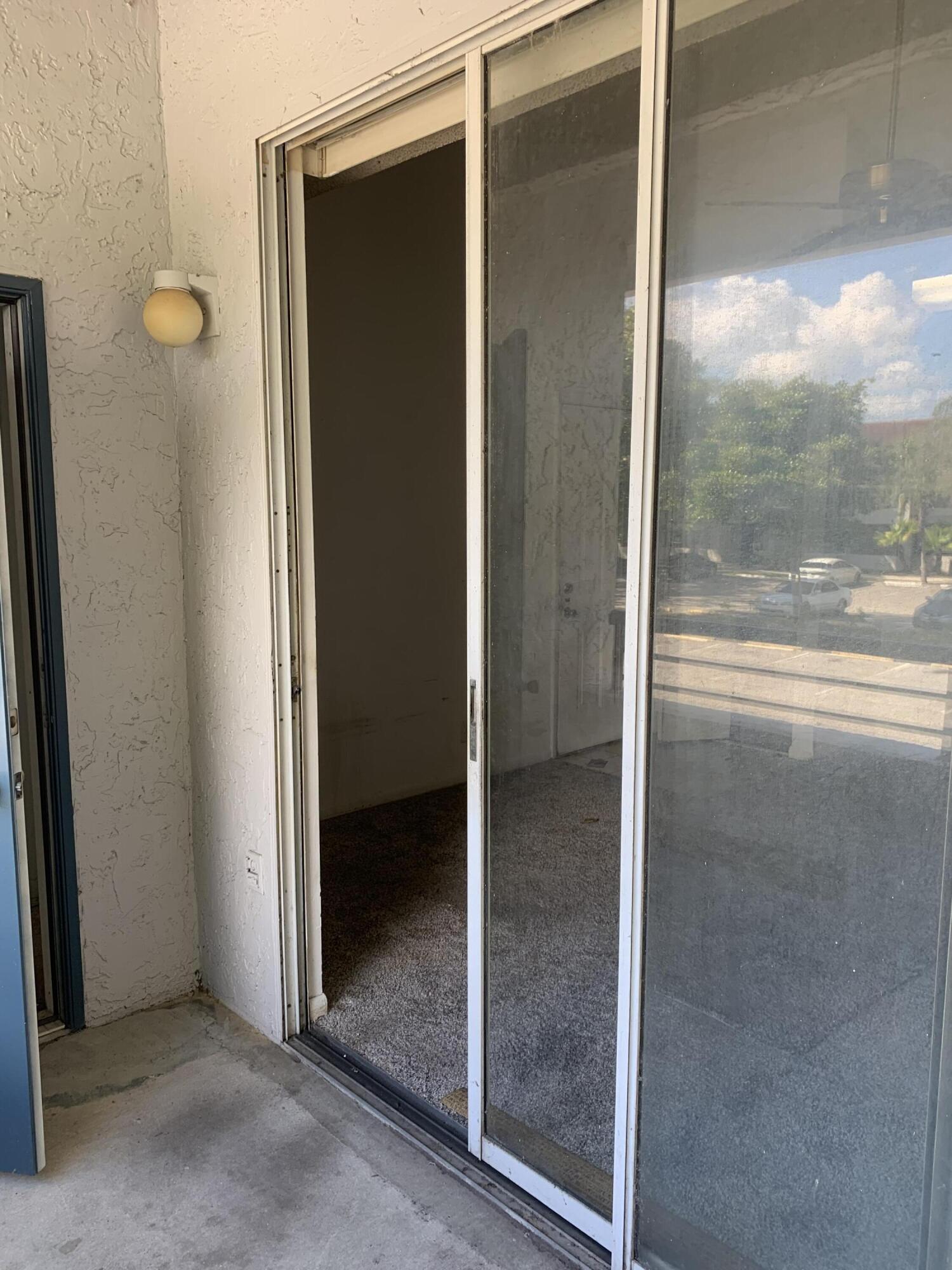 651 Lyons Road, Unit 10207 Coconut Creek, FL 33063 - Photo 12 of 14 Balcony sliding door