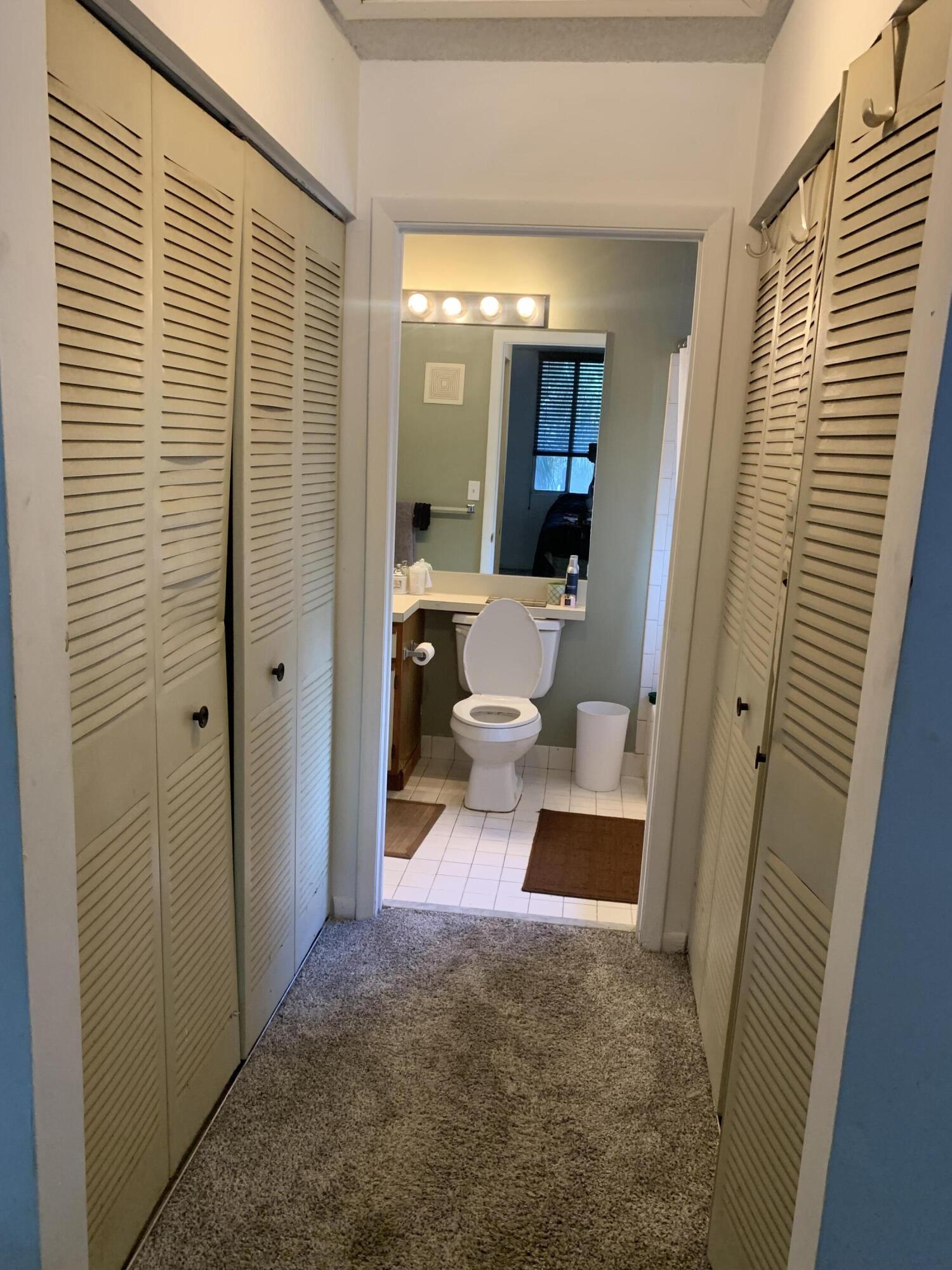 651 Lyons Road, Unit 10207 Coconut Creek, FL 33063 - Photo 4 of 14 Hallway leading to bathroom