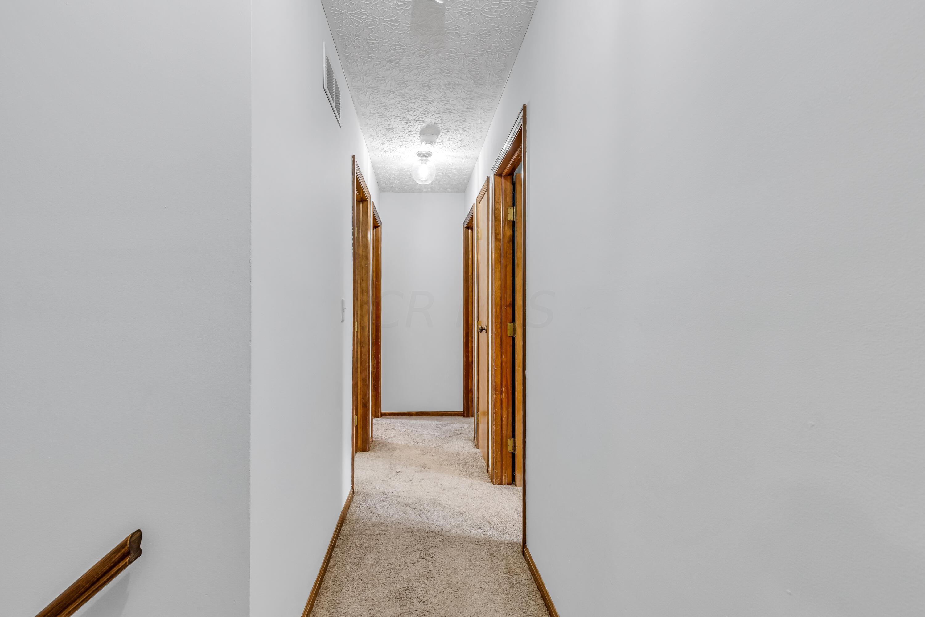 435 Emory Street Gahanna, OH 43230 - Photo 23 of 54 • New light sand carpet ~2022
• Grey painted walls
• Hall linen closet
• (2) ceiling lights