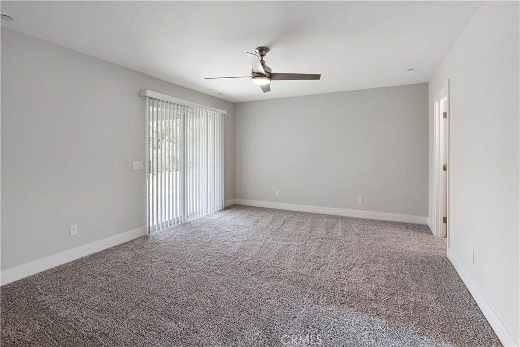 6018 William Street Riverside, CA 92504 - Photo 17 of 59 an empty room with windows and ceiling fan